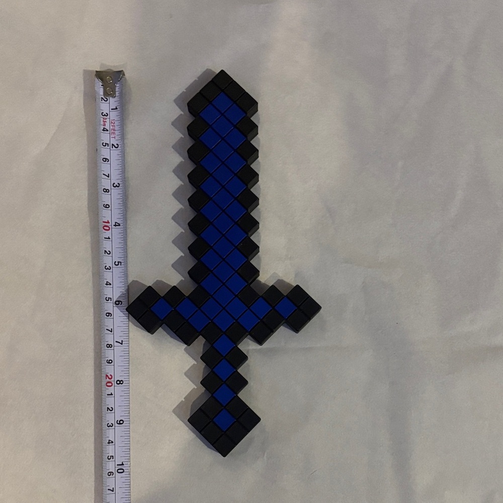 Pixelated Blue and Black Toy Sword